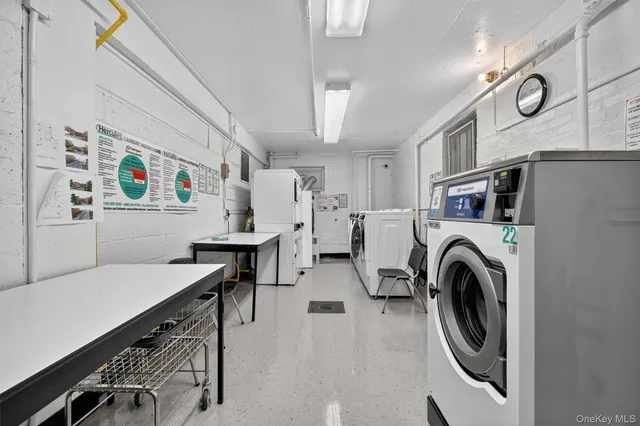 a view of livingroom with washer and dryer