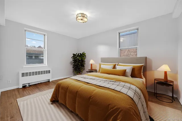 a bedroom with bed and a window