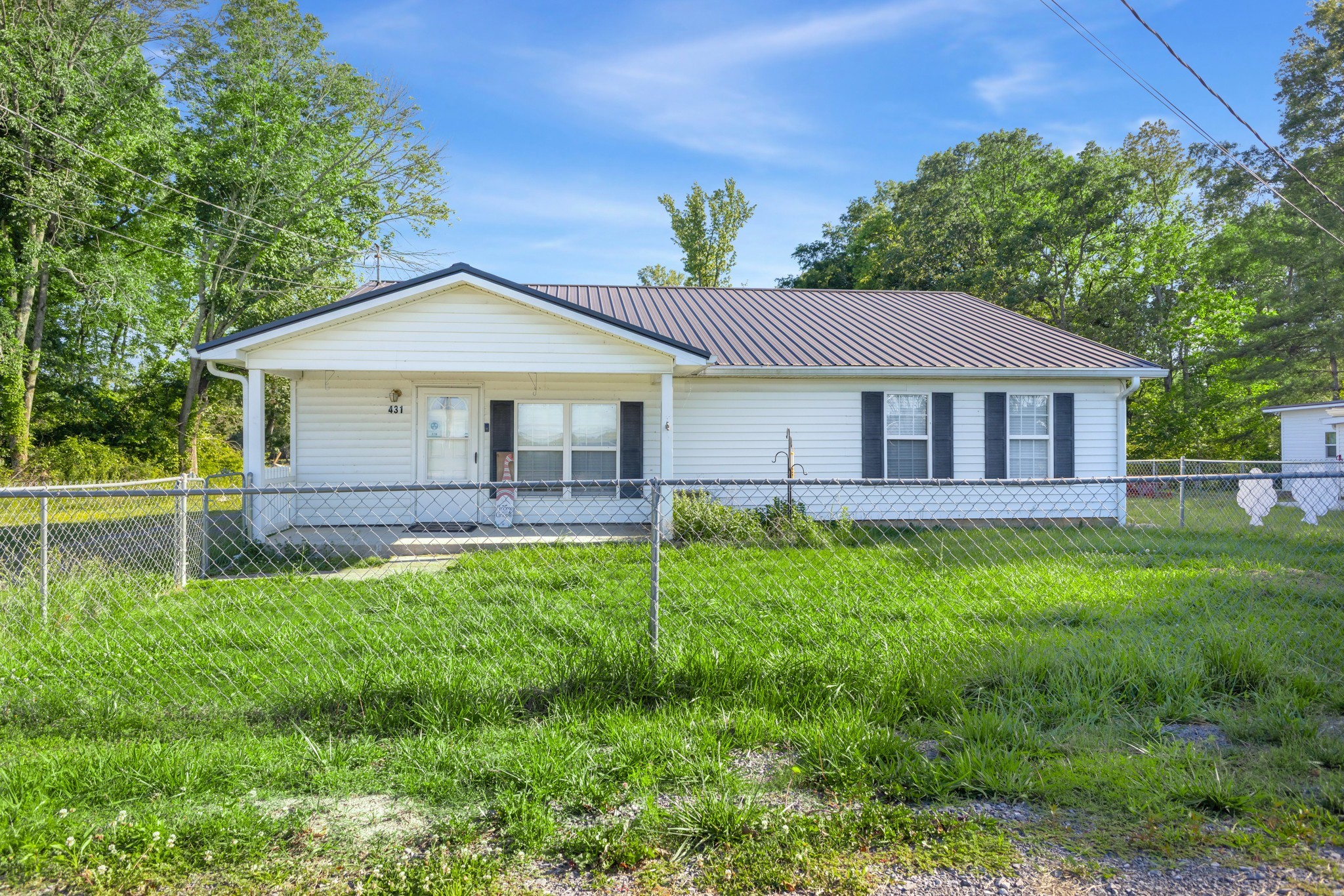 427 South Fair Street Morrison, TN 37357 - Photo 24 of 44 a front view of a house with a garden