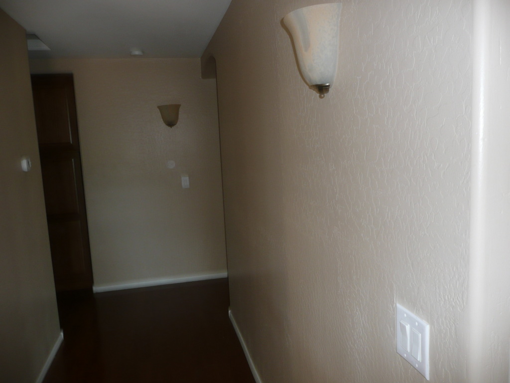 8705 West Cordes Road Tolleson, AZ 85353 - Photo 18 of 25 upstairs hallway laminate floor