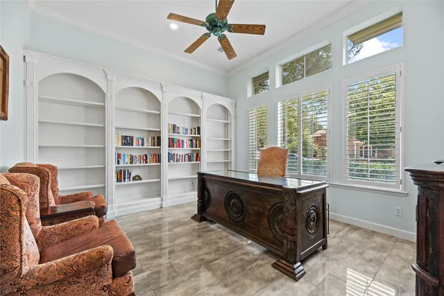 a living room with fireplace furniture and a flat screen tv