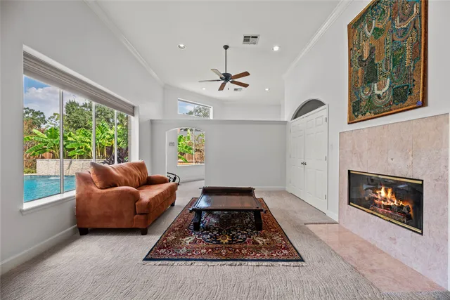 a bedroom with a large bed and a large window
