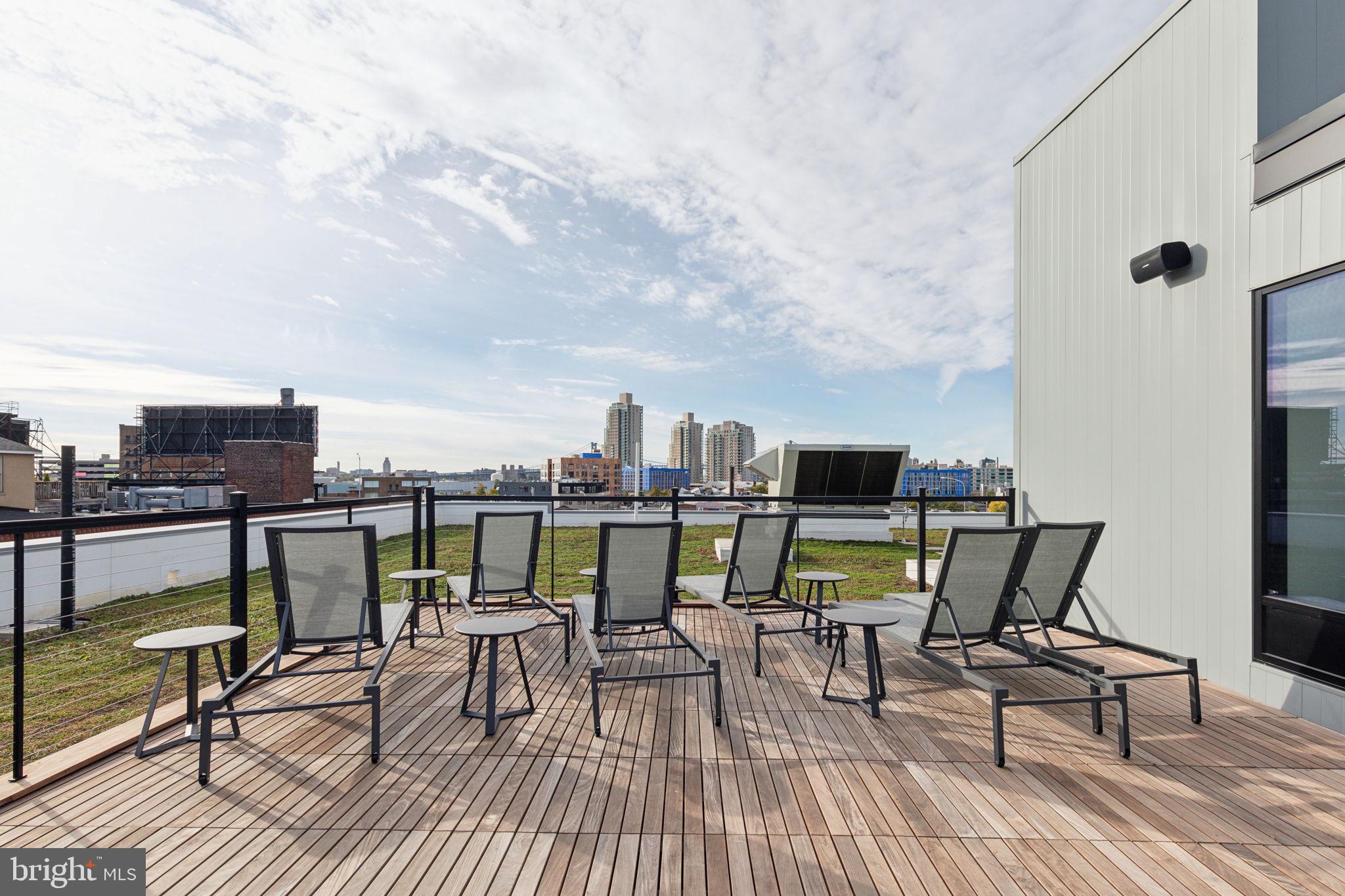 1122 Frankford Avenue, Unit STUDIO A2 Philadelphia, PA 19125 - Photo 19 of 45 a view of chairs on the deck