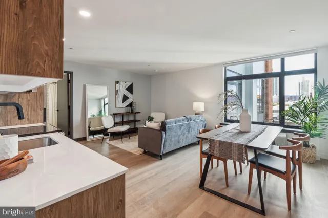a view of a livingroom with furniture and a window