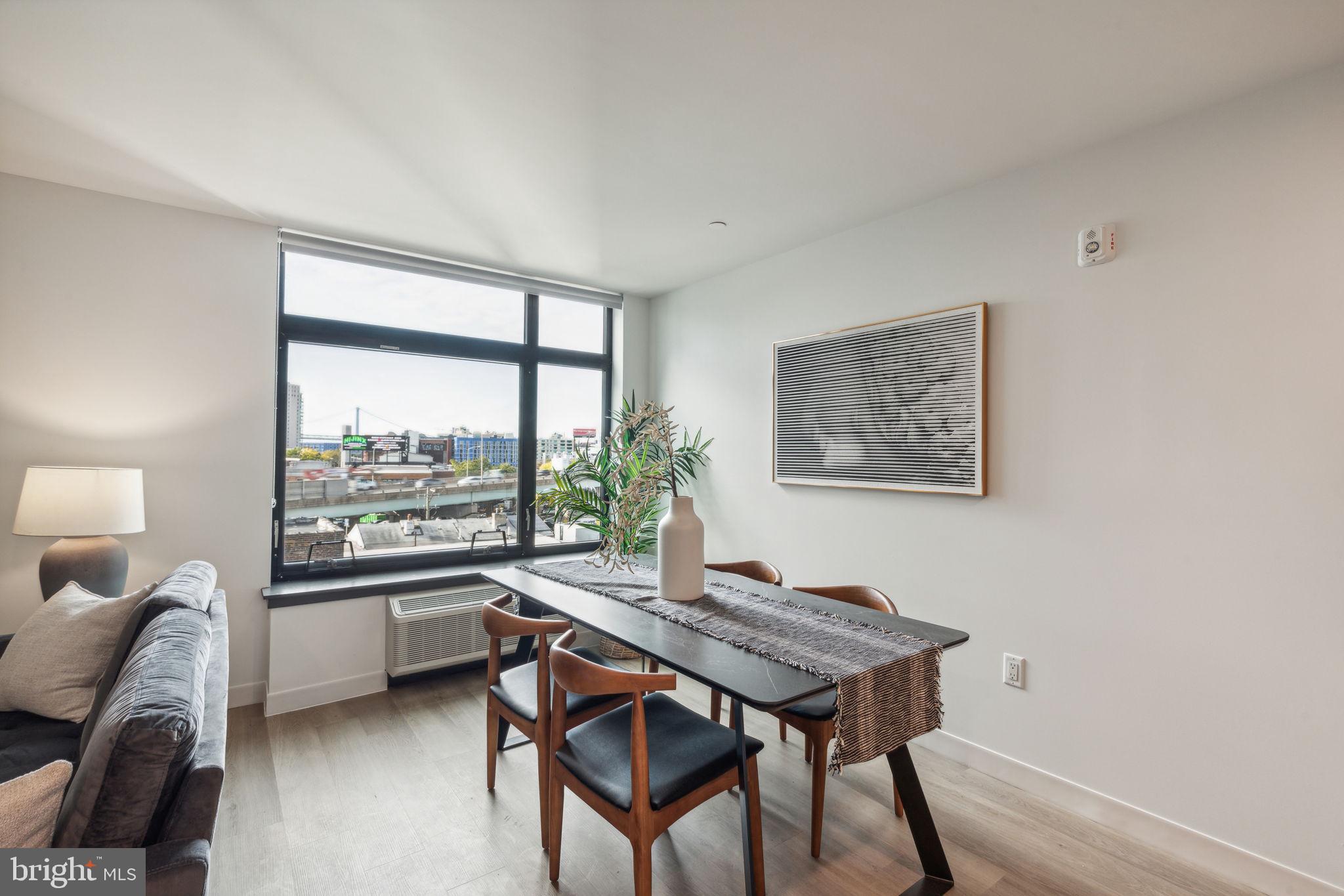 1122 Frankford Avenue, Unit STUDIO A2 Philadelphia, PA 19125 - Photo 23 of 45 a view of a livingroom with furniture and a window