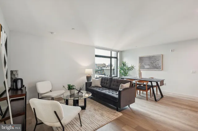 a kitchen with stainless steel appliances a refrigerator stove top oven and cabinets