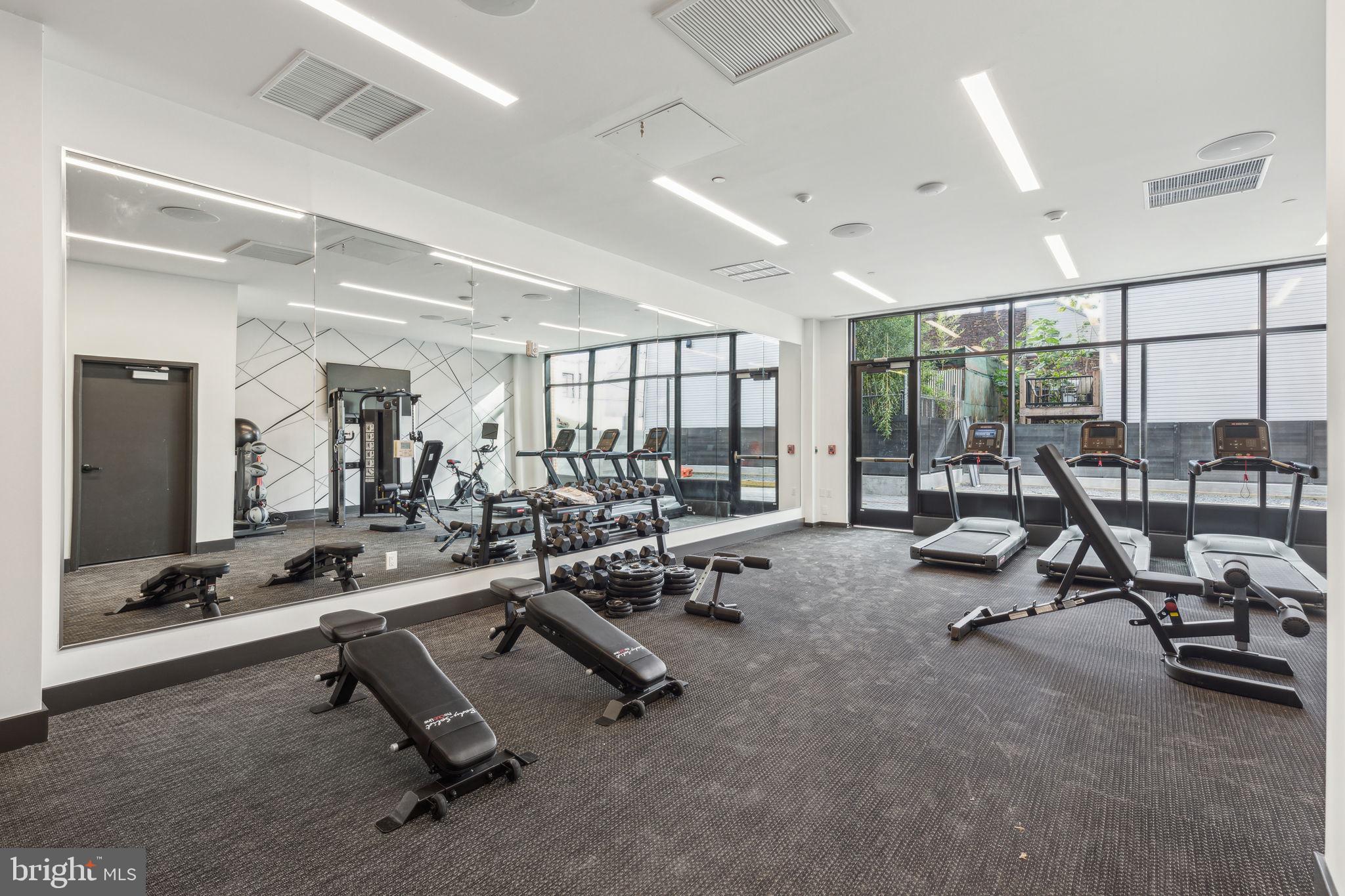 1122 Frankford Avenue, Unit STUDIO A2 Philadelphia, PA 19125 - Photo 41 of 45 a view of a room with gym equipment