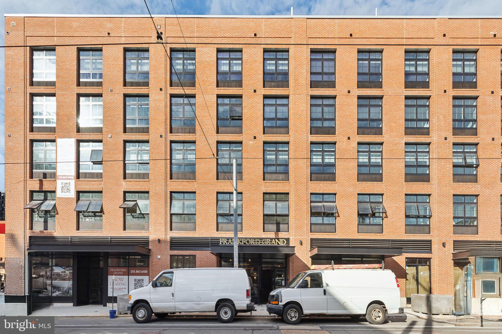 1122 Frankford Avenue, Unit STUDIO A2 Philadelphia, PA 19125 - Photo 44 of 45 a car parked in front of a building