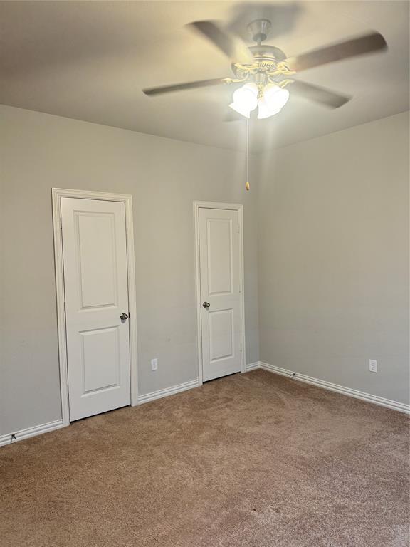 4475 Samarth Street Irving, TX 75061 - Photo 16 of 26 a view of an empty room and chandelier fan