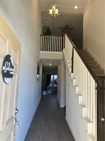 a view of a hallway view with staircase