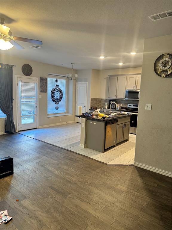 4475 Samarth Street Irving, TX 75061 - Photo 6 of 26 a kitchen with stainless steel appliances granite countertop a stove and a refrigerator