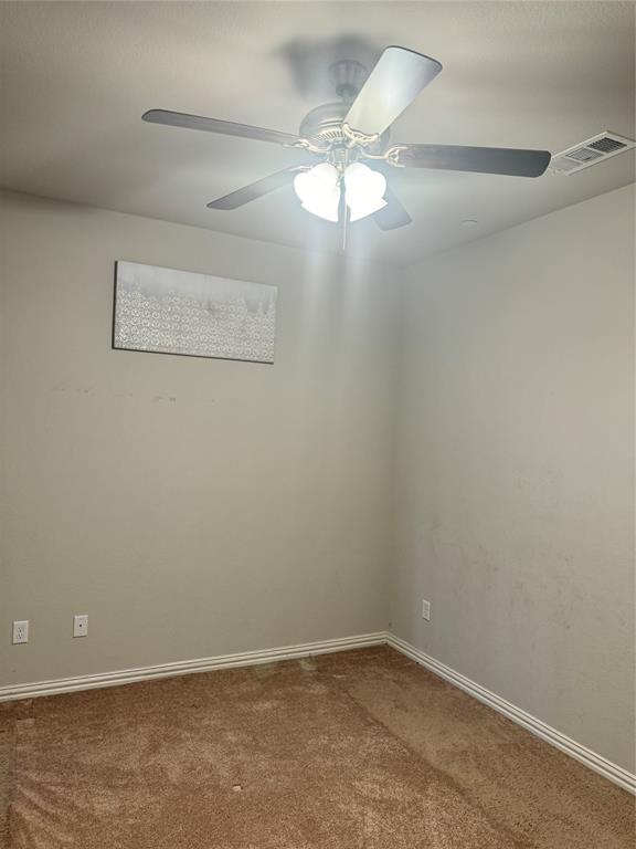 4475 Samarth Street Irving, TX 75061 - Photo 7 of 26 en empty room with a fan and a window