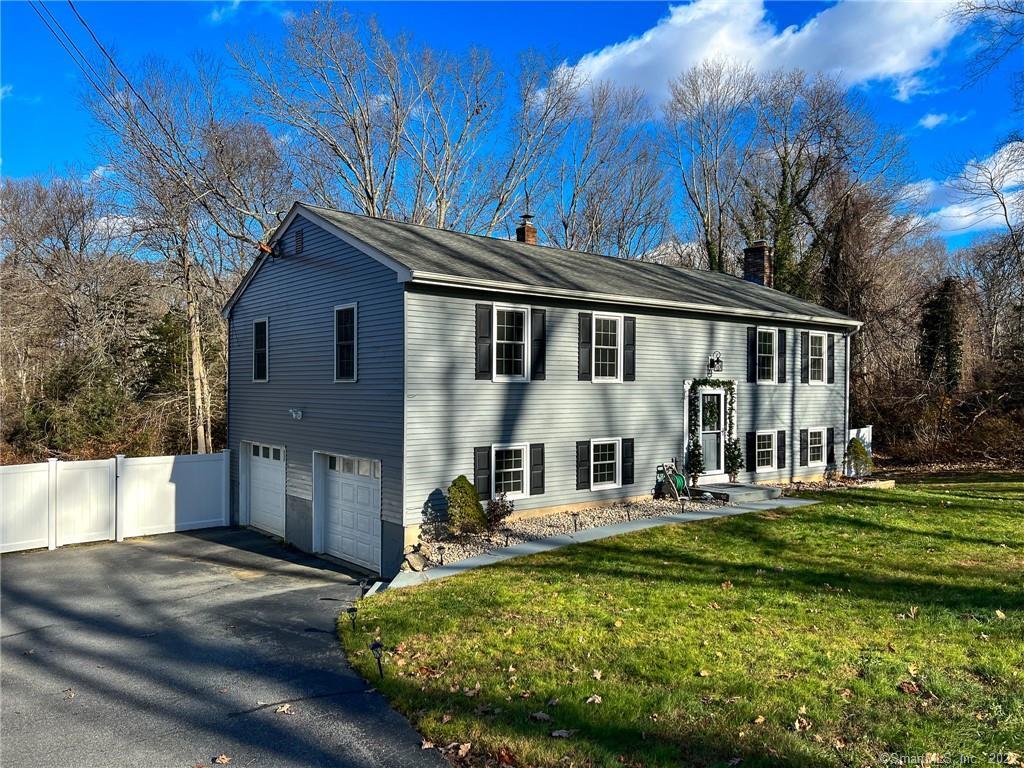 38 Inchcliffe Drive Ledyard, CT 06335 - Photo 1 of 1 a front view of a house with a garden