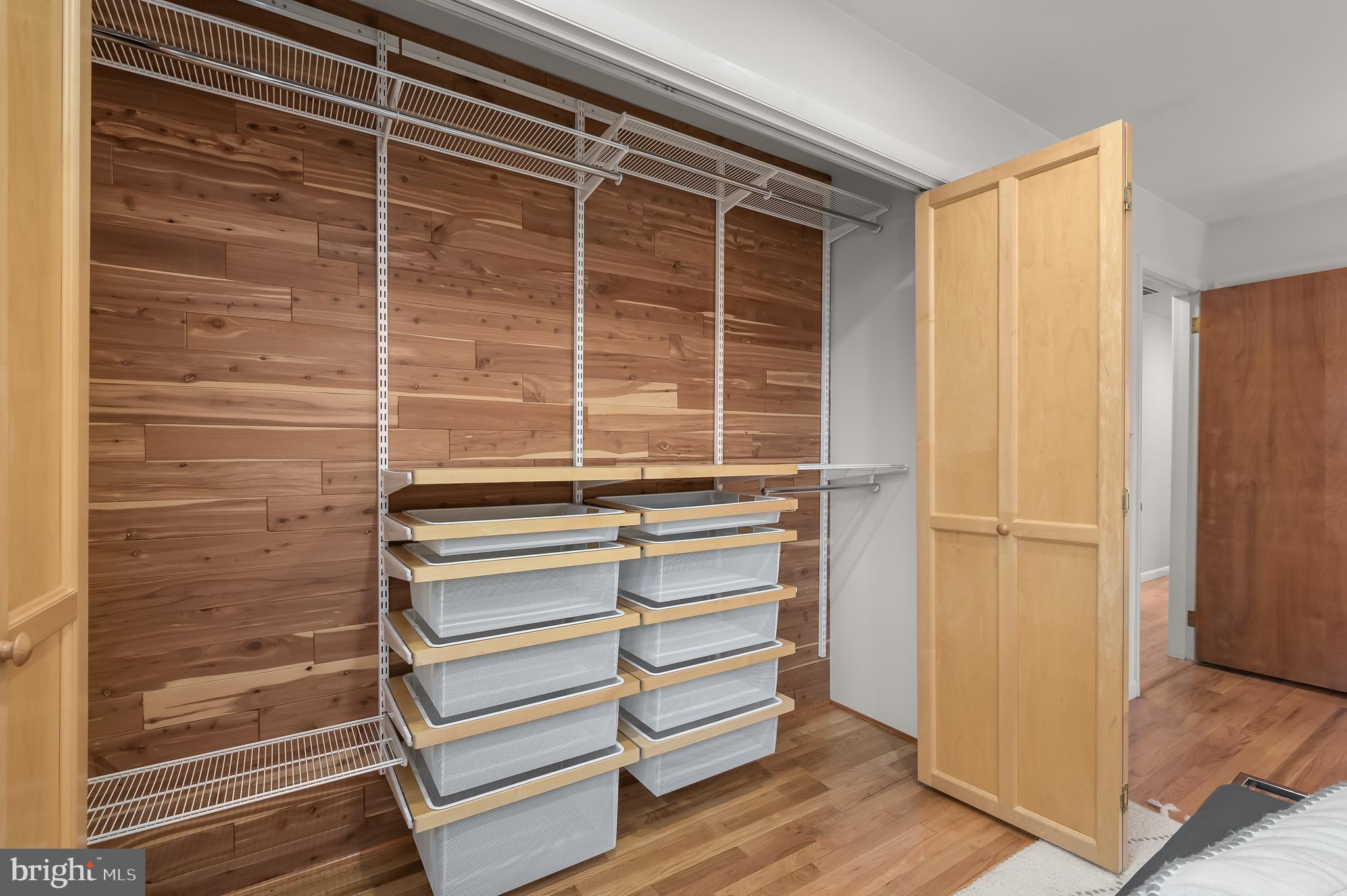 10600 Lilac Place Silver Spring, MD 20903 - Photo 24 of 43 a view of walk in closet with empty racks