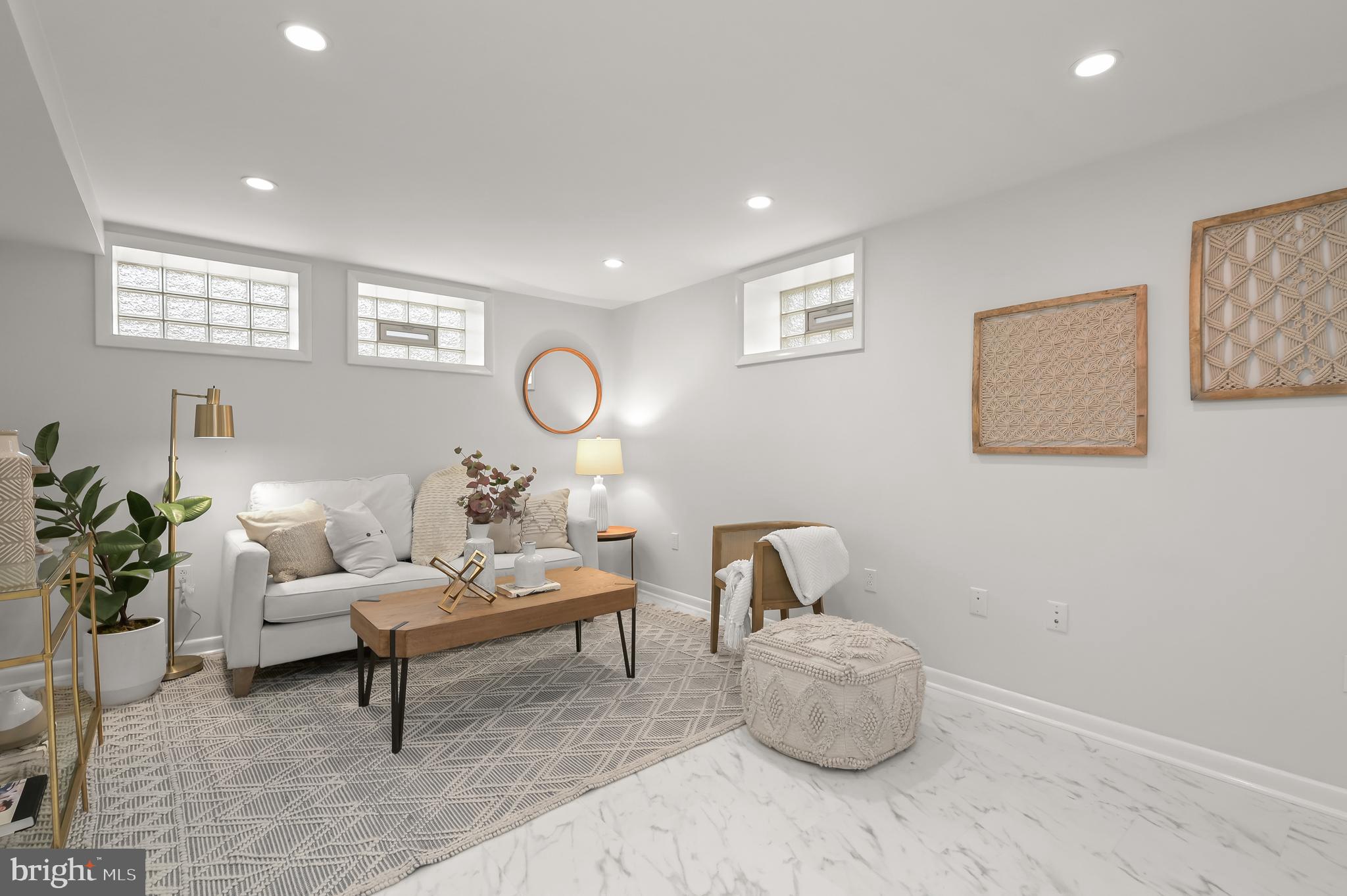10600 Lilac Place Silver Spring, MD 20903 - Photo 33 of 43 a living room with furniture and a potted plant