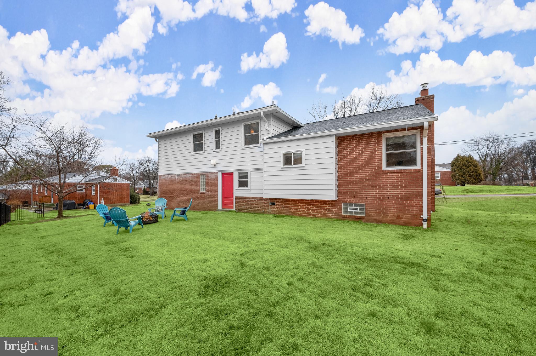 10600 Lilac Place Silver Spring, MD 20903 - Photo 41 of 43 a front view of house with yard and trees