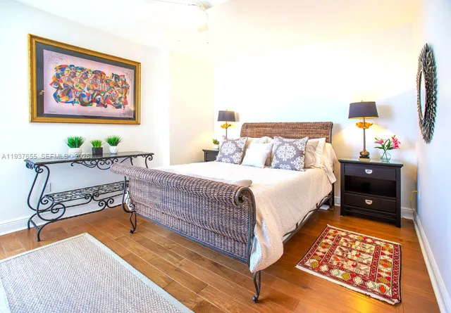 a bedroom with furniture and a lamp