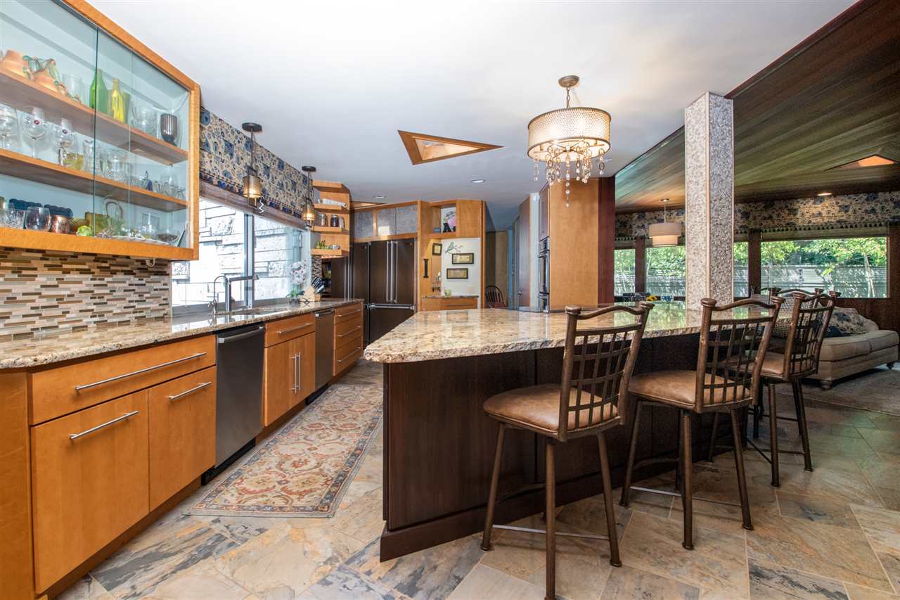 2121 Harlem Boulevard Rockford, IL 61103 - Photo 13 of 25 a large kitchen with a table and chairs