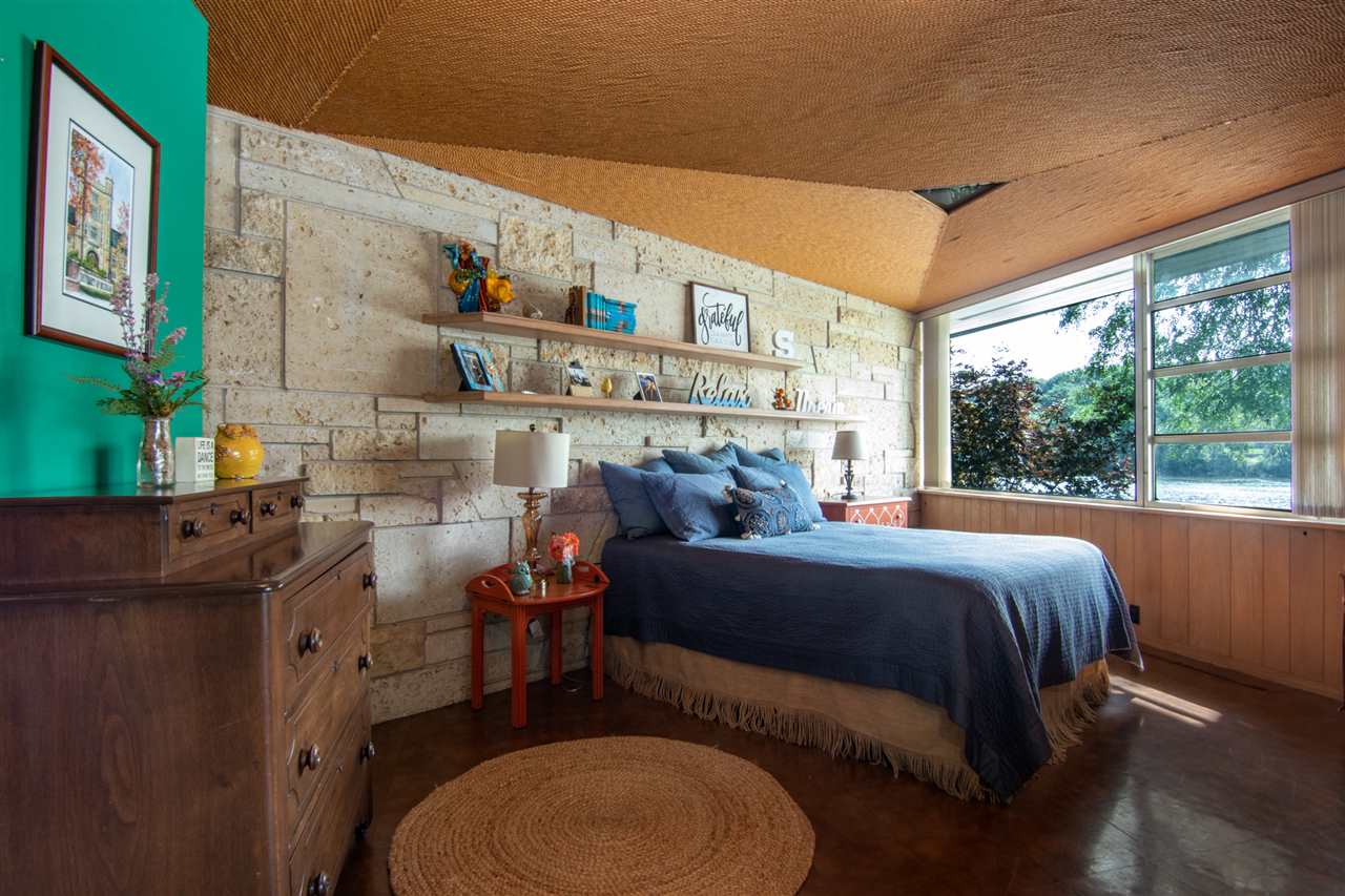 2121 Harlem Boulevard Rockford, IL 61103 - Photo 18 of 25 a bed room with a bed and a chair