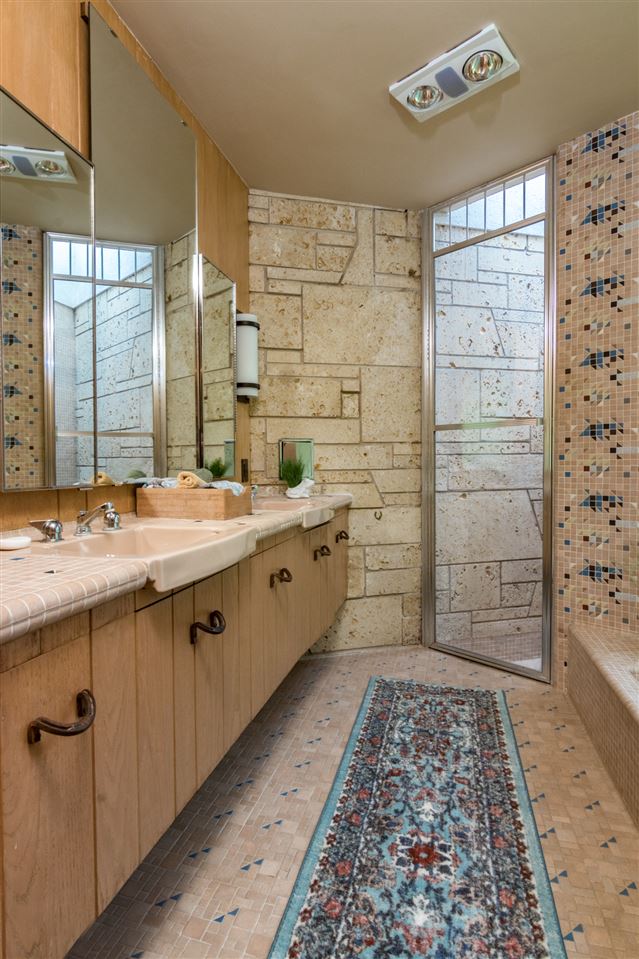 2121 Harlem Boulevard Rockford, IL 61103 - Photo 20 of 25 a bathroom with a double vanity sink a toilet and shower