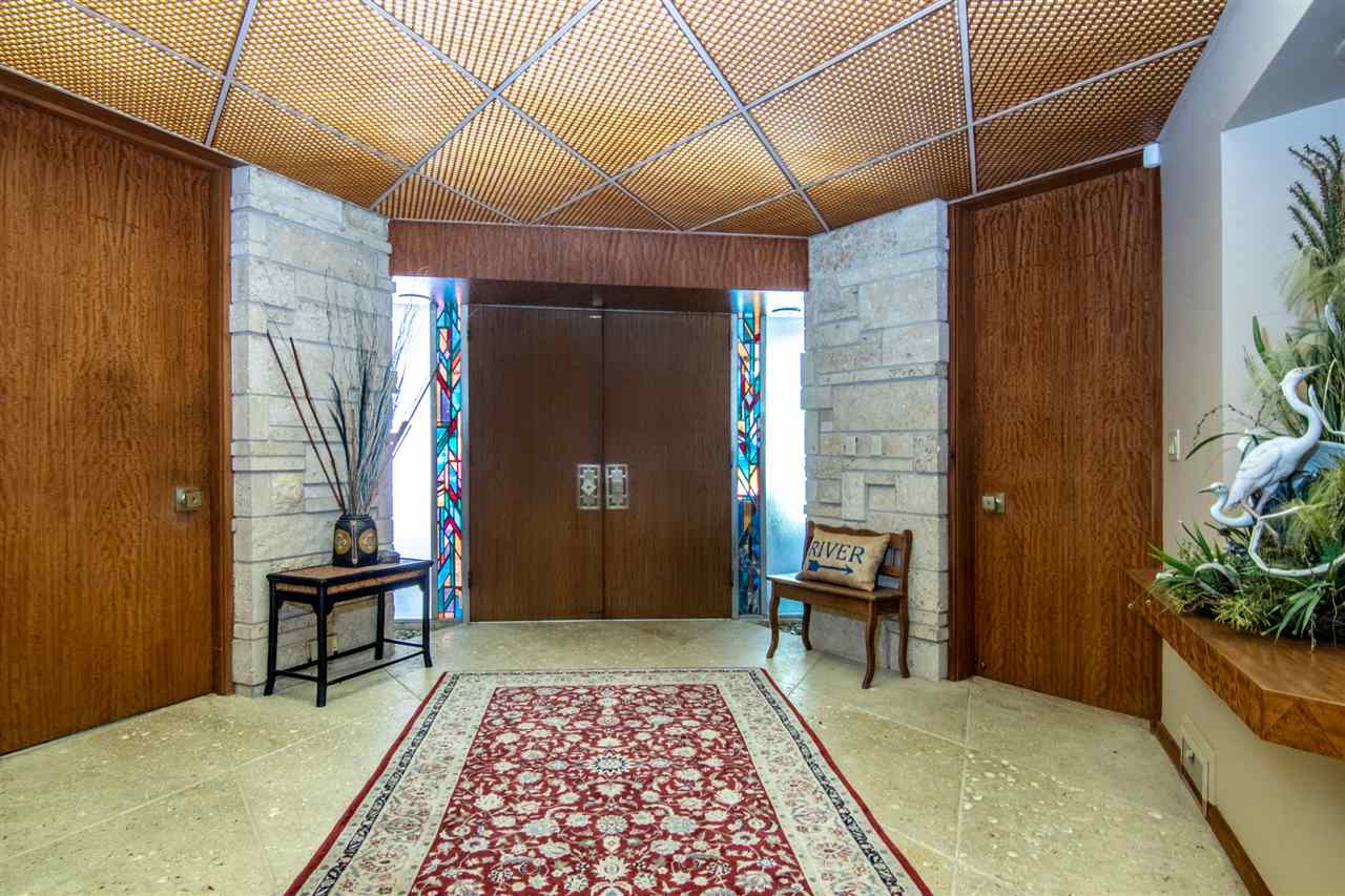 2121 Harlem Boulevard Rockford, IL 61103 - Photo 4 of 25 a view of a hallway with furniture and window