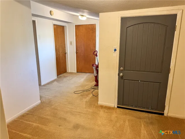 a view of a house with a tree