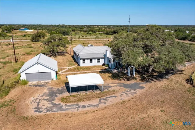 a living room with a bed and furniture