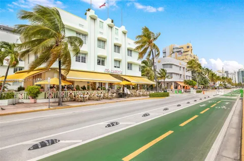 a view of a building and a cars park