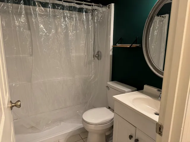 a bathroom with a toilet and a sink