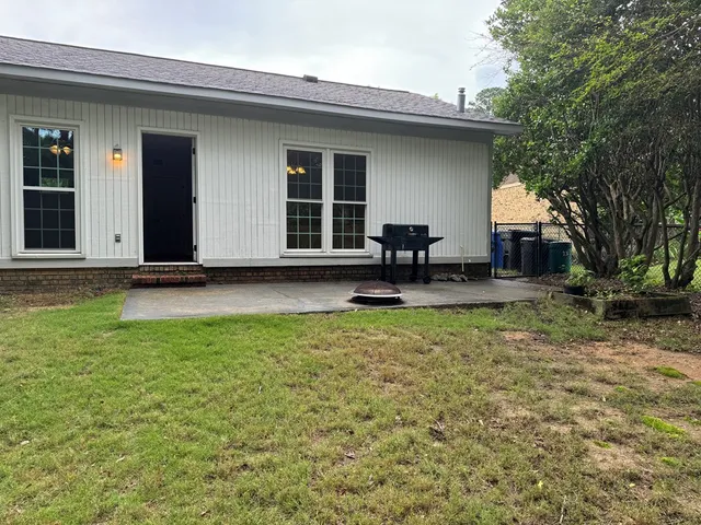 a backyard of a house with seating space