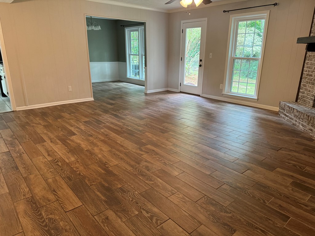 6443 Gloucester Court Columbus, GA 31909 - Photo 4 of 20 an empty room with wooden floor and windows