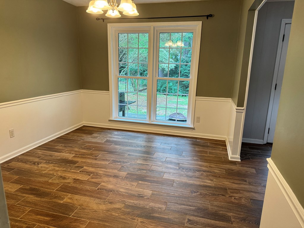 6443 Gloucester Court Columbus, GA 31909 - Photo 9 of 20 a view of a room with wooden floor and a window
