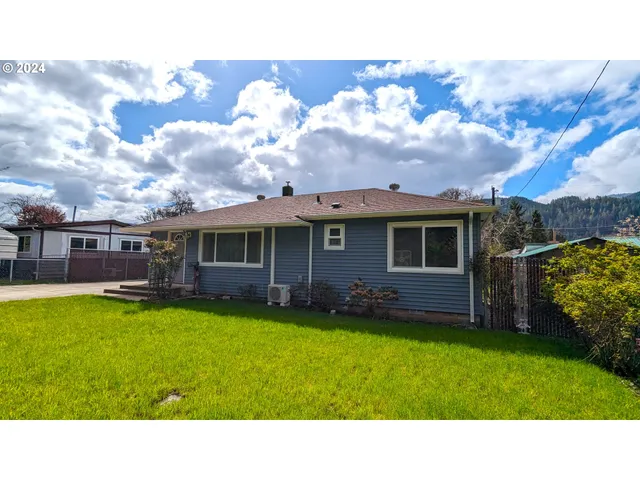 a black and white photo of a house