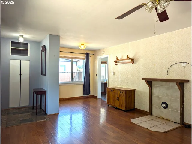 a living room with wooden floor and furniture with wooden floor