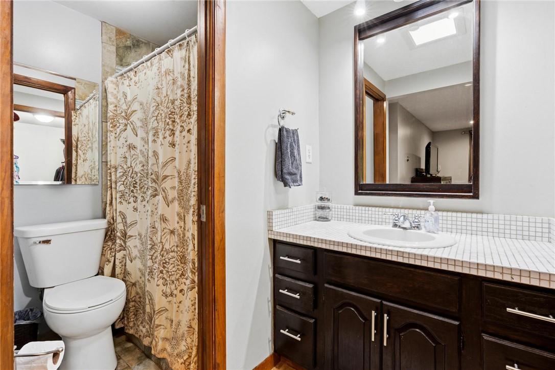 1940 Armstrong Road Fairborn, OH 45324 - Photo 34 of 48 This bathroom features a functional vanity with a sleek sink and a classic shower-tub combination.