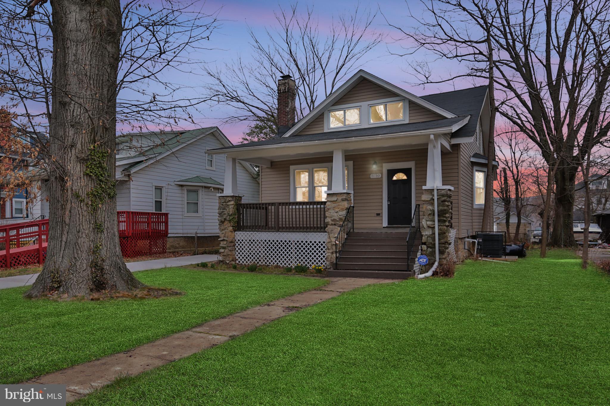 3710 Barrington Road Baltimore, MD 21215 - Photo 1 of 25 a view of a house with a yard and a large tree