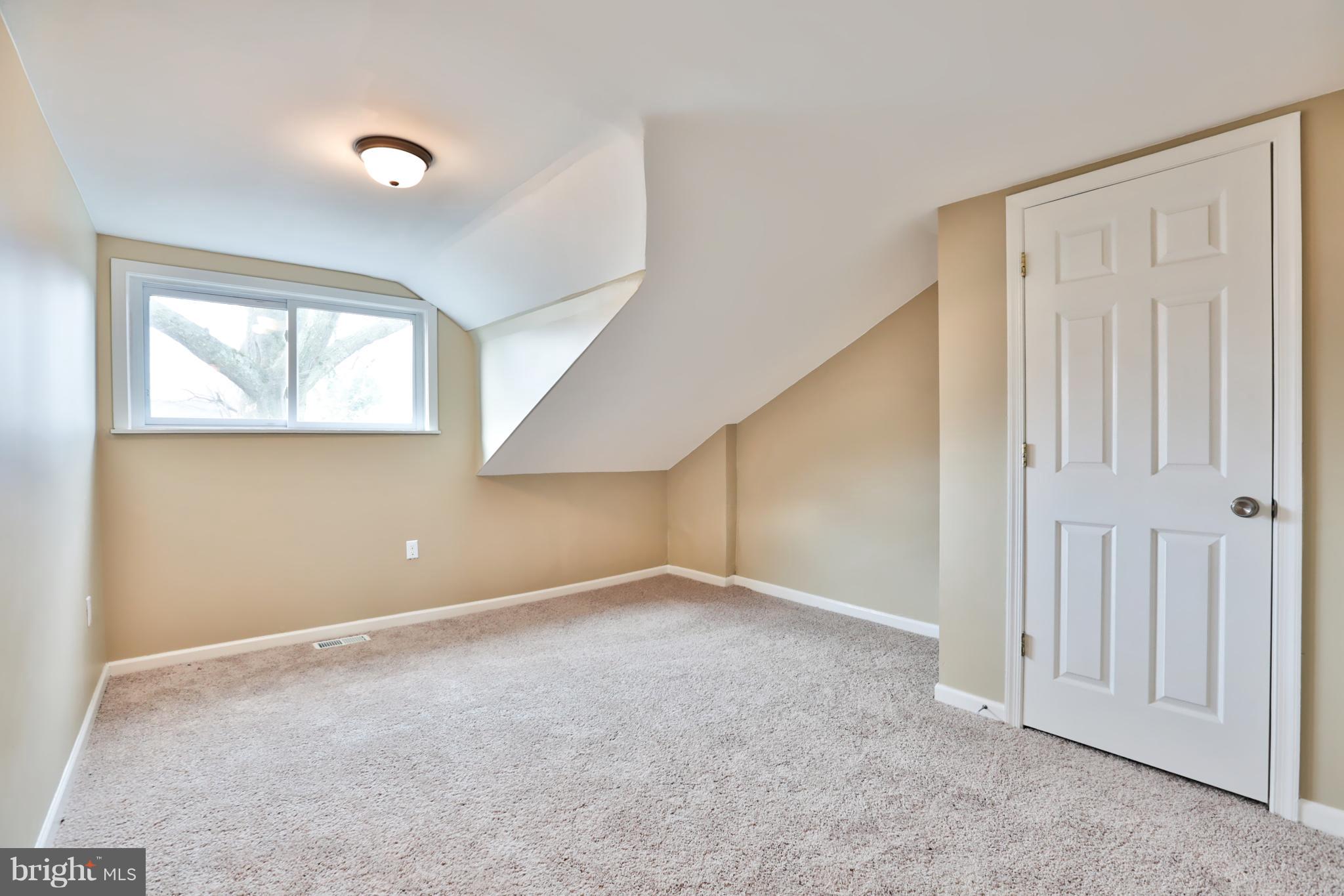 3710 Barrington Road Baltimore, MD 21215 - Photo 17 of 25 an empty room with windows