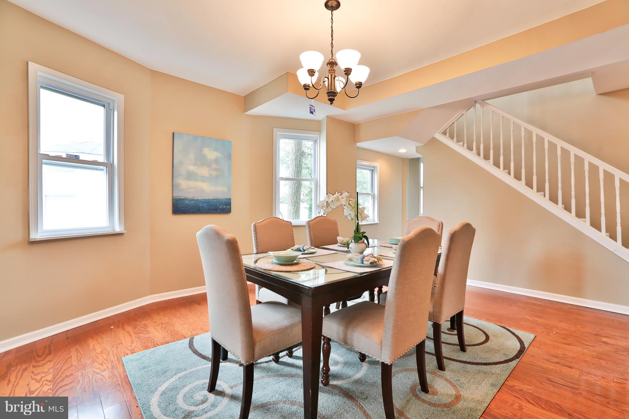 3710 Barrington Road Baltimore, MD 21215 - Photo 4 of 25 a view of a dining room with furniture window and wooden floor