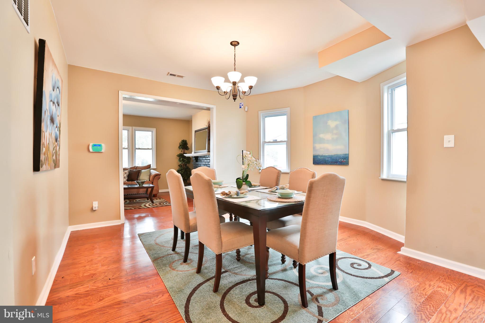 3710 Barrington Road Baltimore, MD 21215 - Photo 5 of 25 a view of a a dining room with furniture window and wooden floor