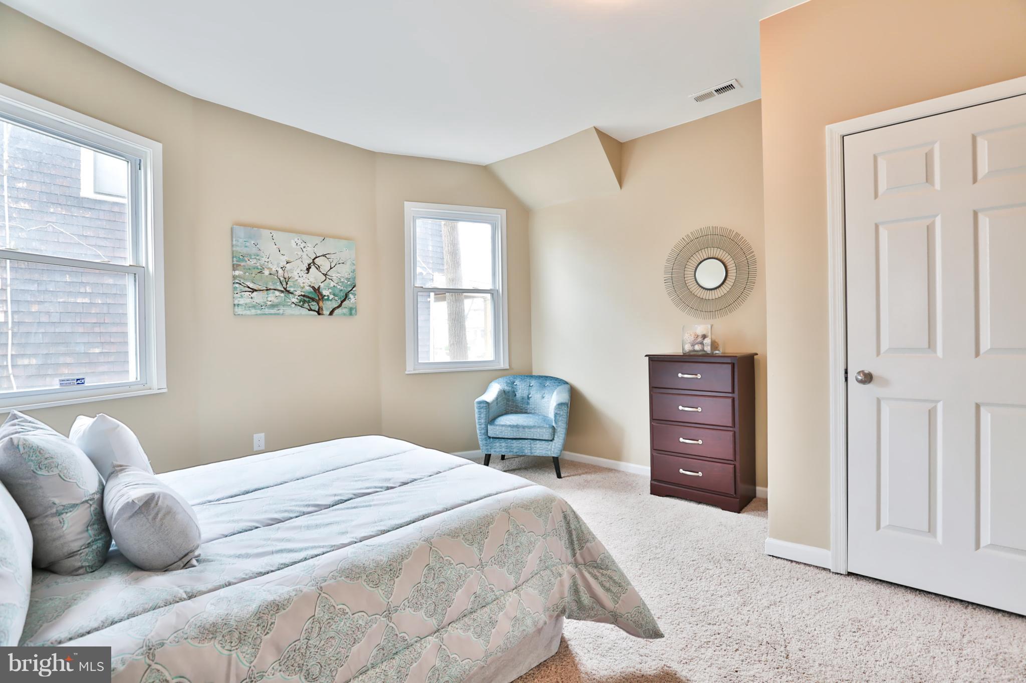 3710 Barrington Road Baltimore, MD 21215 - Photo 9 of 25 a bedroom with a bed and a window
