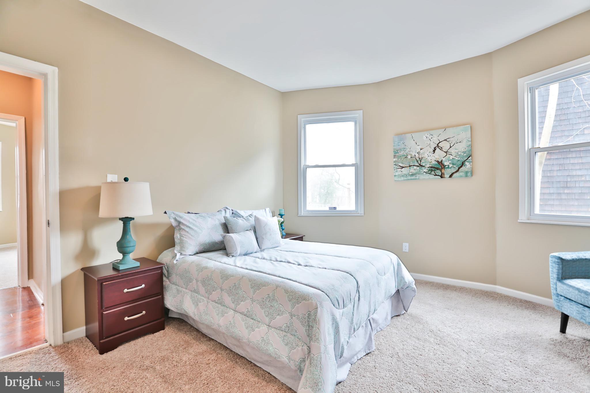 3710 Barrington Road Baltimore, MD 21215 - Photo 10 of 25 a bedroom with a bed and a window