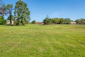 3523 East Highway 199 Springtown, TX 76082 - Photo 13 of 15 a view of a field with trees in the background