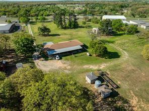 3523 East Highway 199 Springtown, TX 76082 - Photo 2 of 15 an aerial view of a house with a yard and lake view