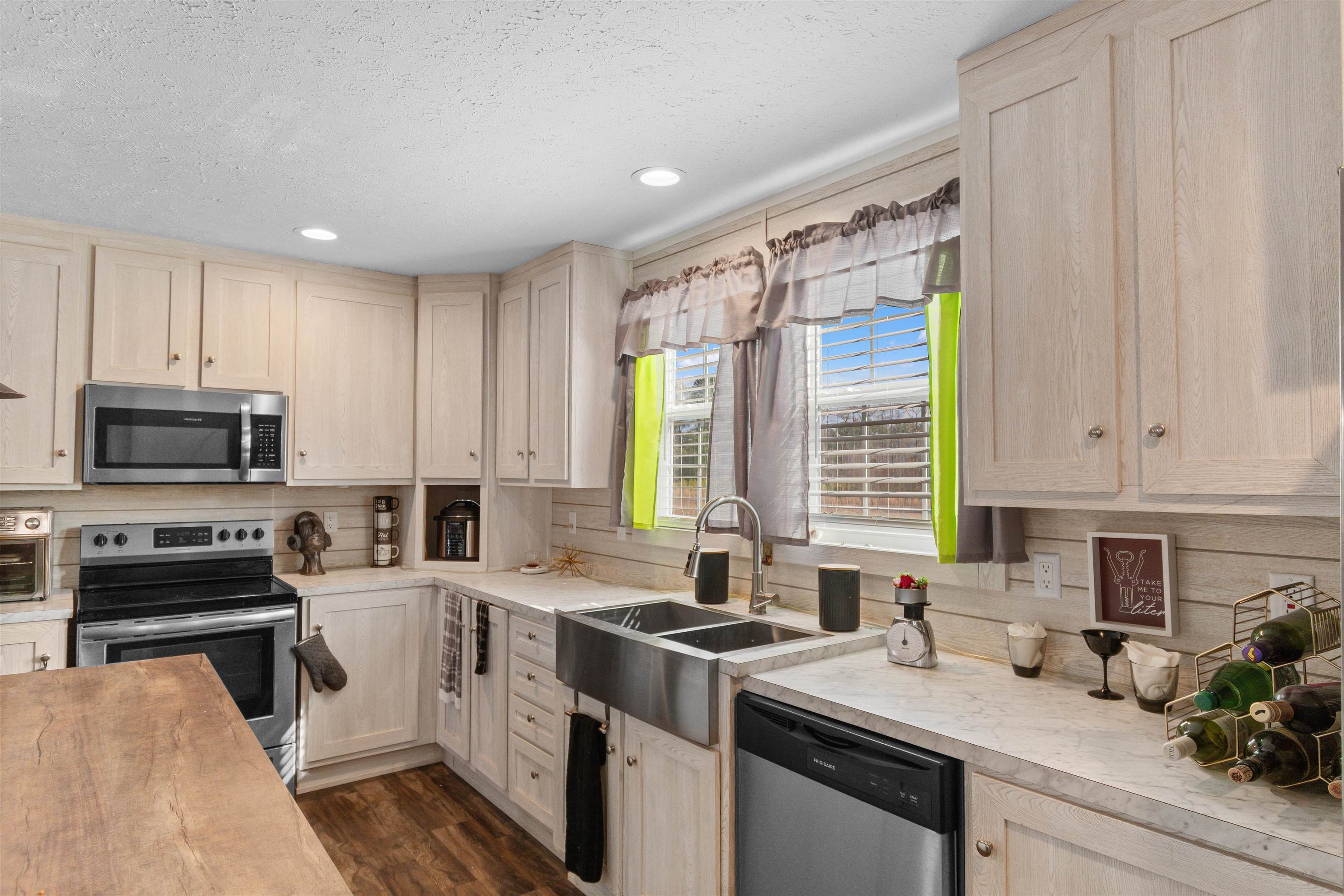 2482 Wigley Road Loris, SC 29569 - Photo 16 of 39 Kitchen featuring decorative light fixtures, appliances with stainless steel finishes, recessed lighting, wooden counters, and a textured ceiling
