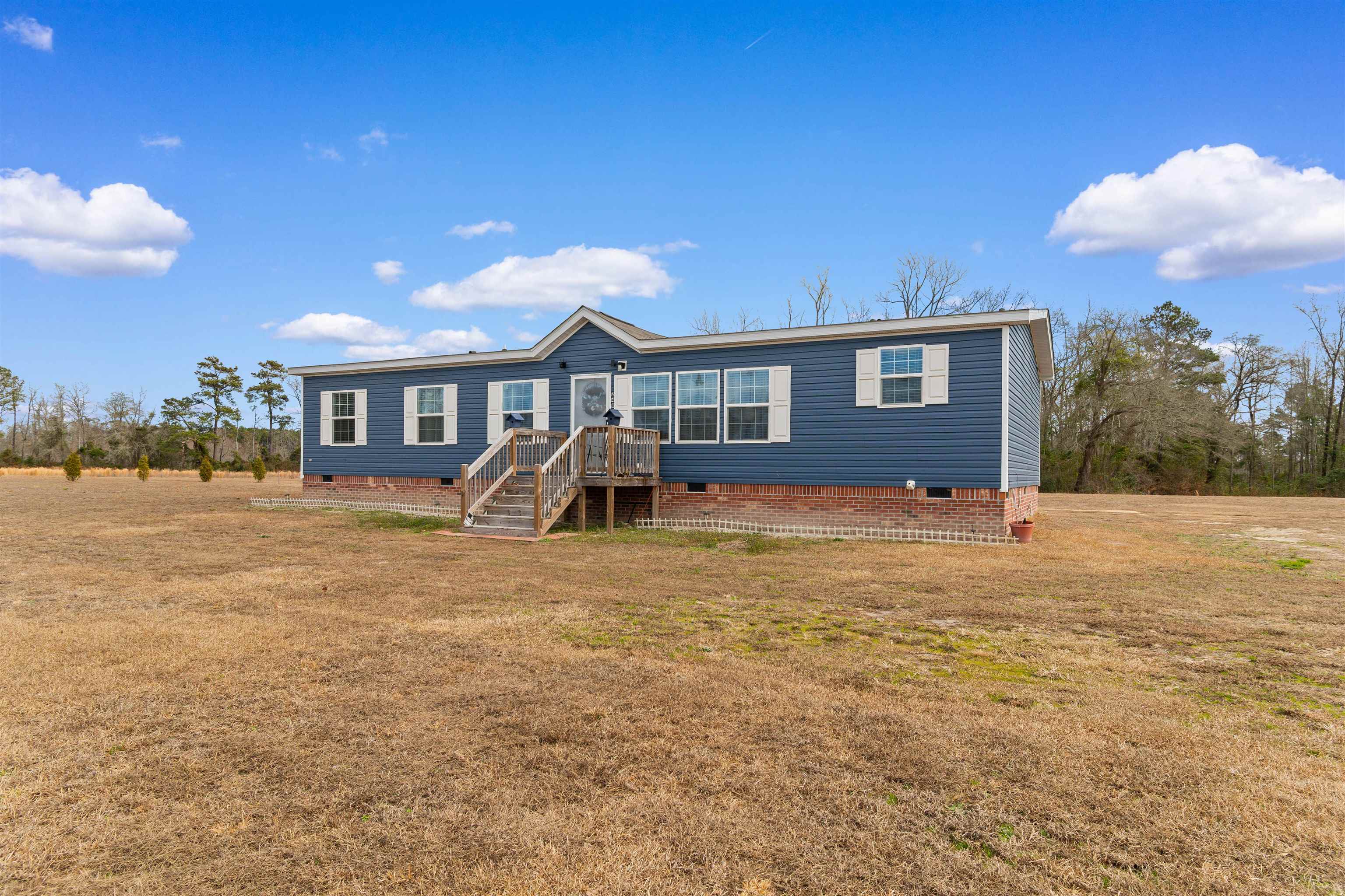 2482 Wigley Road Loris, SC 29569 - Photo 2 of 39 Manufactured / mobile home featuring crawl space and a front lawn