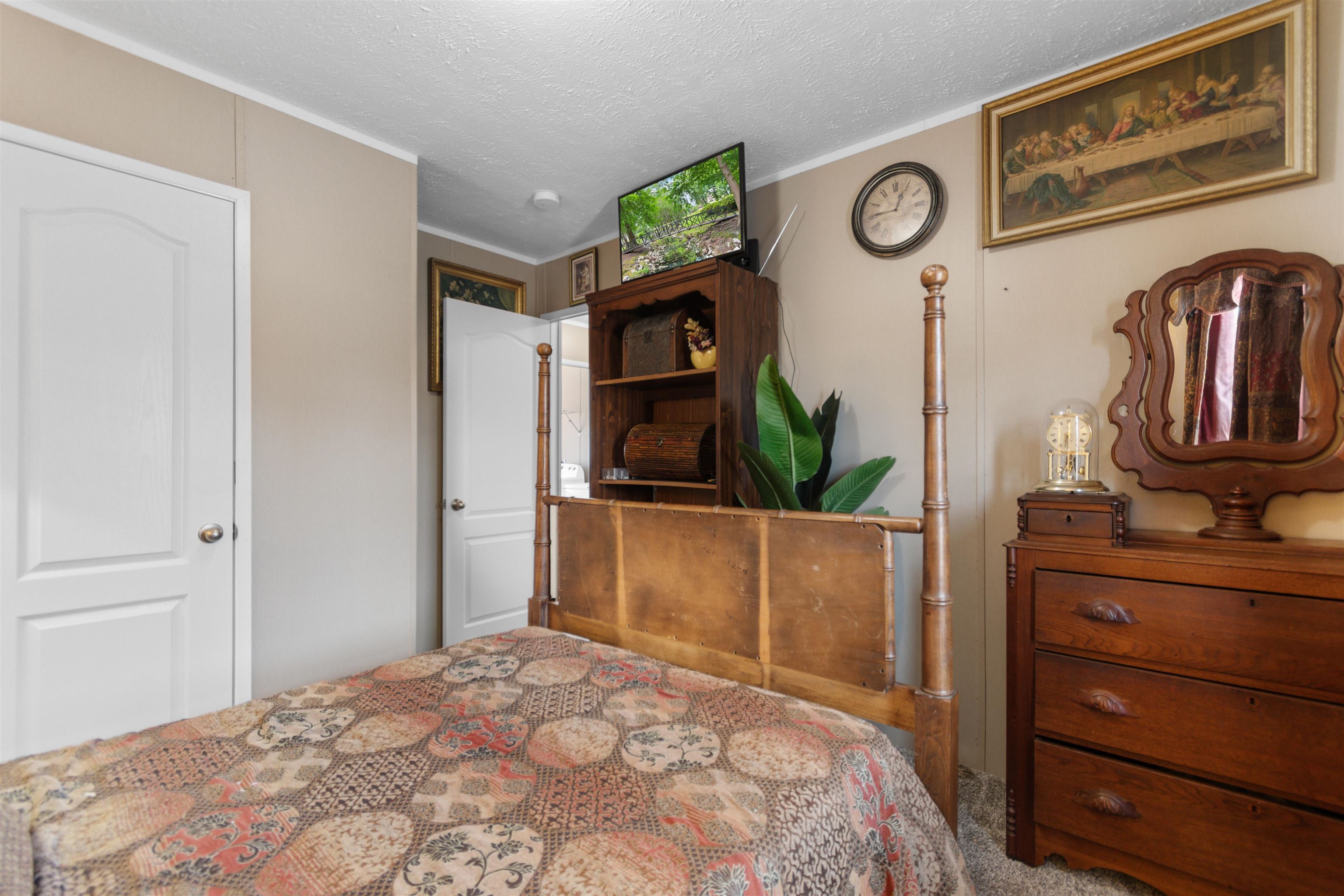 2482 Wigley Road Loris, SC 29569 - Photo 27 of 39 Bedroom featuring carpet flooring and a textured ceiling