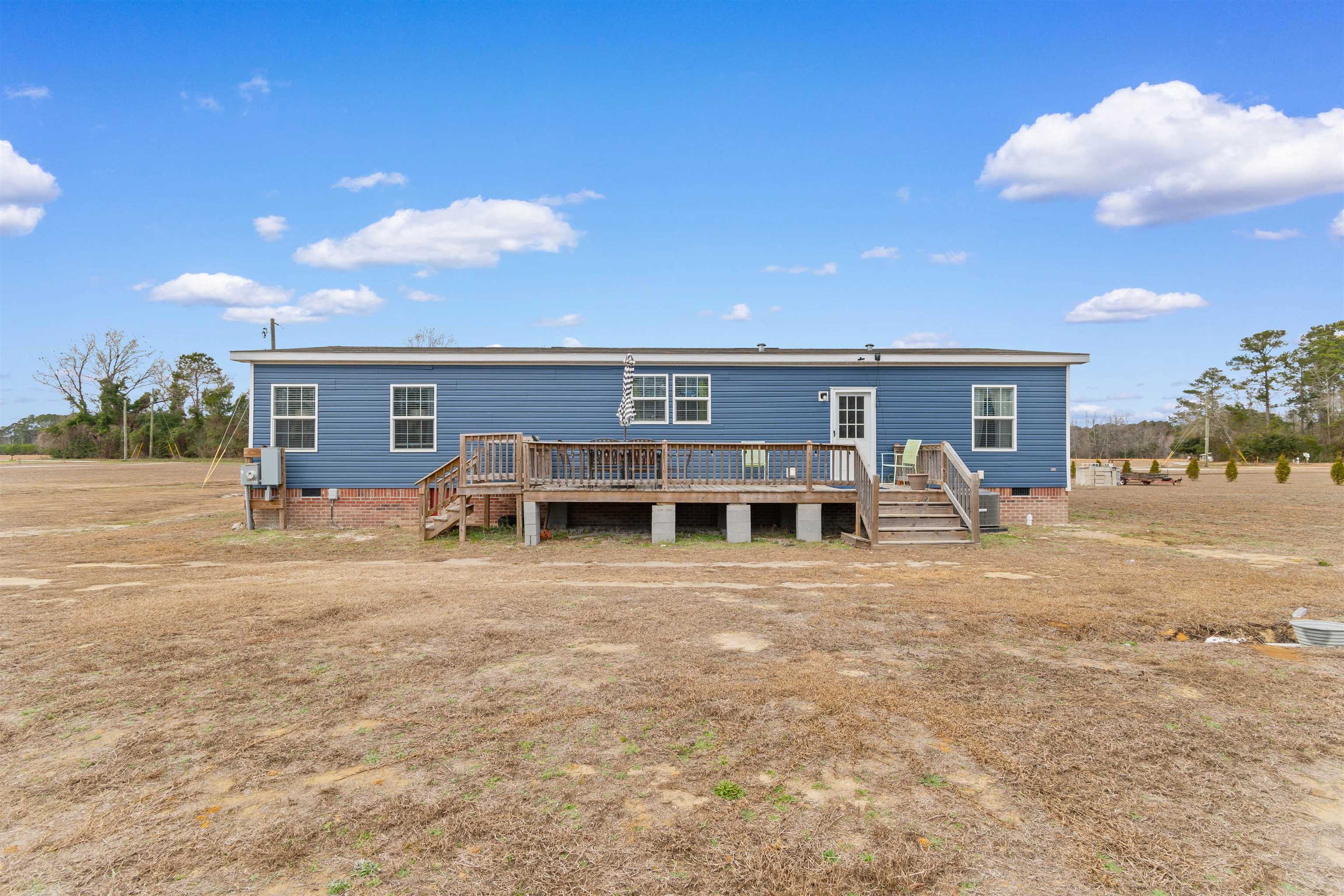 2482 Wigley Road Loris, SC 29569 - Photo 35 of 39 Rear view of property with stairs, a wooden deck, and crawl space