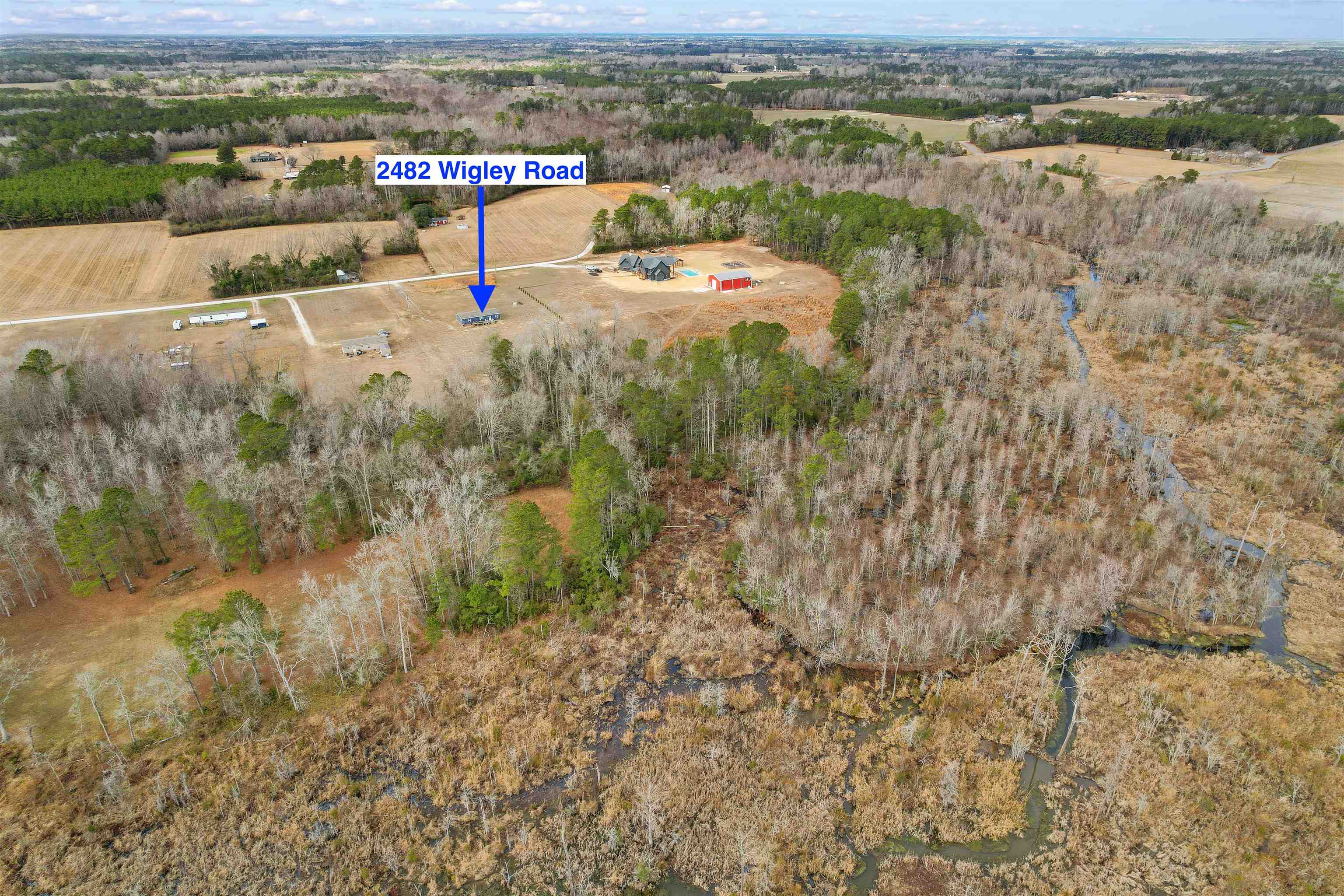 2482 Wigley Road Loris, SC 29569 - Photo 38 of 39 Aerial view of sparsely populated area with a forest