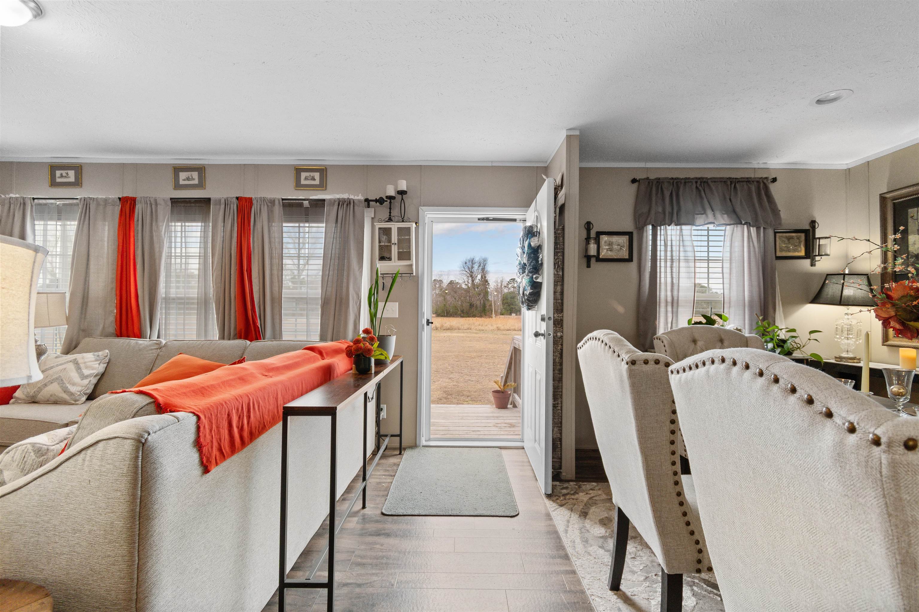 2482 Wigley Road Loris, SC 29569 - Photo 6 of 39 Living room featuring healthy amount of natural light, wood finished floors, and crown molding