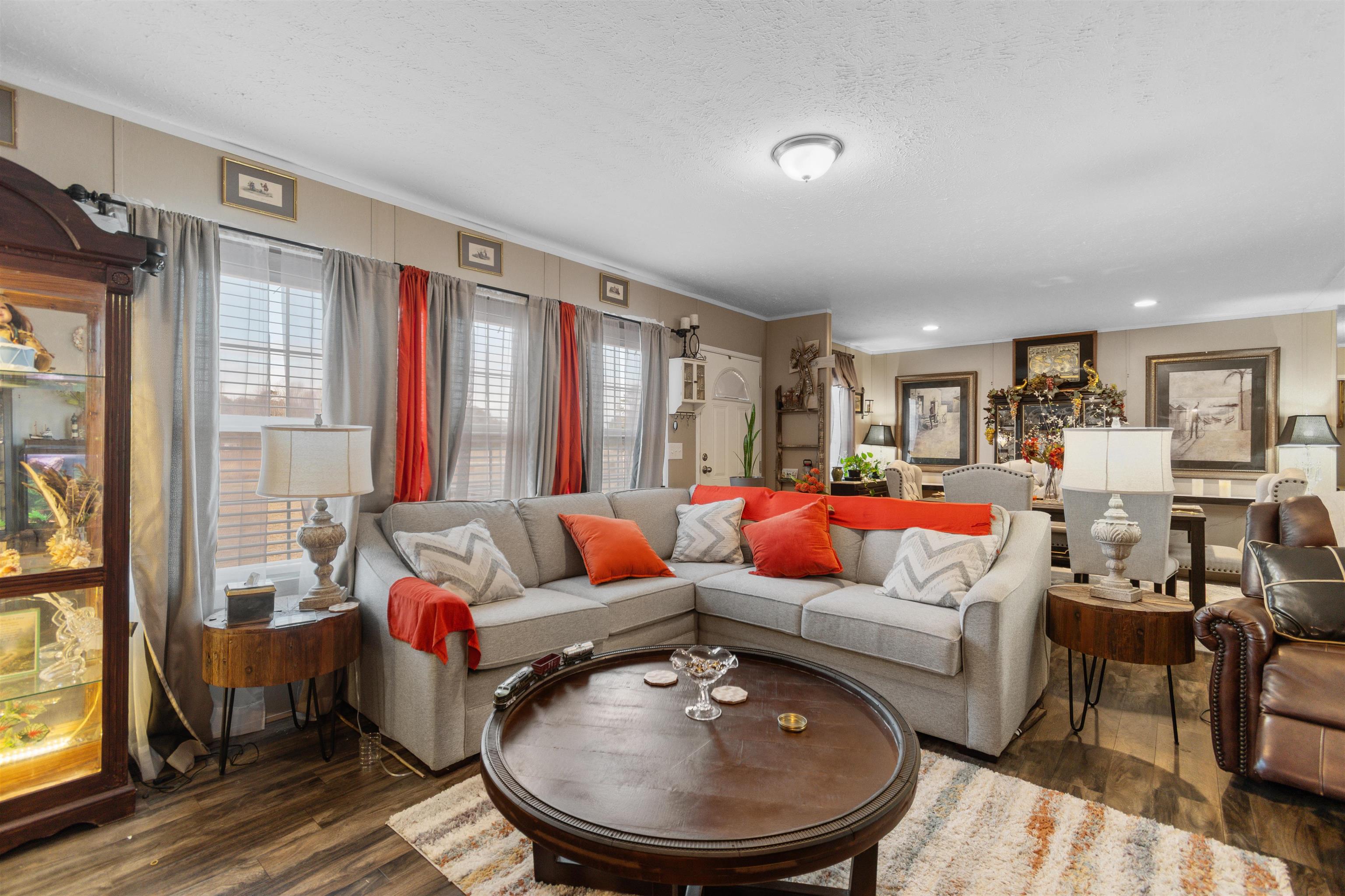 2482 Wigley Road Loris, SC 29569 - Photo 10 of 39 Living room with wood finished floors, a textured ceiling, and wooden walls